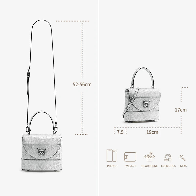 Echtleder-Schultertasche (Maße 19×7,5×17 cm) mit Katzenkopf-Frontklappe und Riemen.