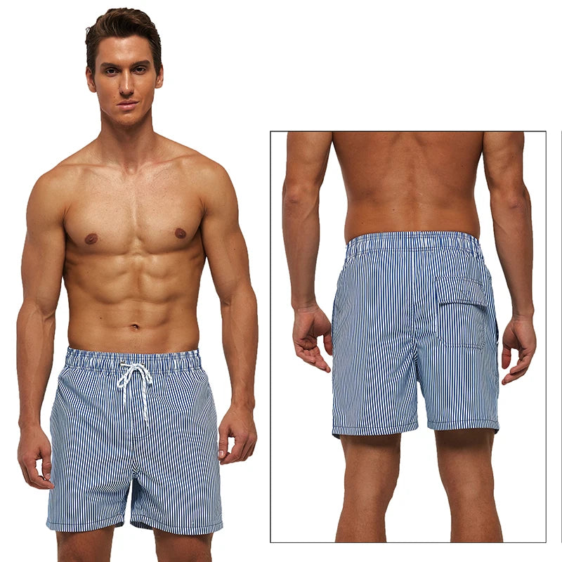 Kurze Herren-Shorts mit Print, Reißverschlusstaschen und schnelltrocknendem Material – ideal für Strand und Sport.