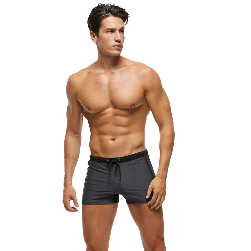 Lange Herren-Shorts mit Polyesterfutter und seitlicher Reißverschlusstasche – ideal für Fitnessstudio und Schwimmen