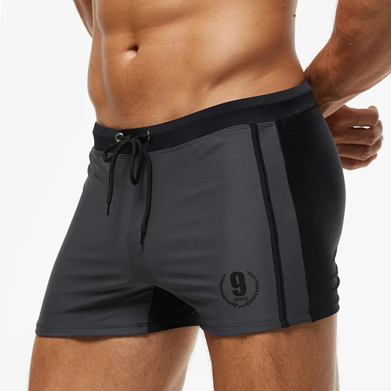 Lange Herren-Shorts mit Polyesterfutter und seitlicher Reißverschlusstasche – ideal für Fitnessstudio und Schwimmen