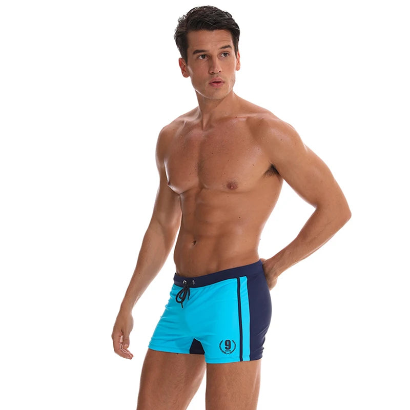 Lange Herren-Shorts mit Polyesterfutter und seitlicher Reißverschlusstasche – ideal für Fitnessstudio und Schwimmen