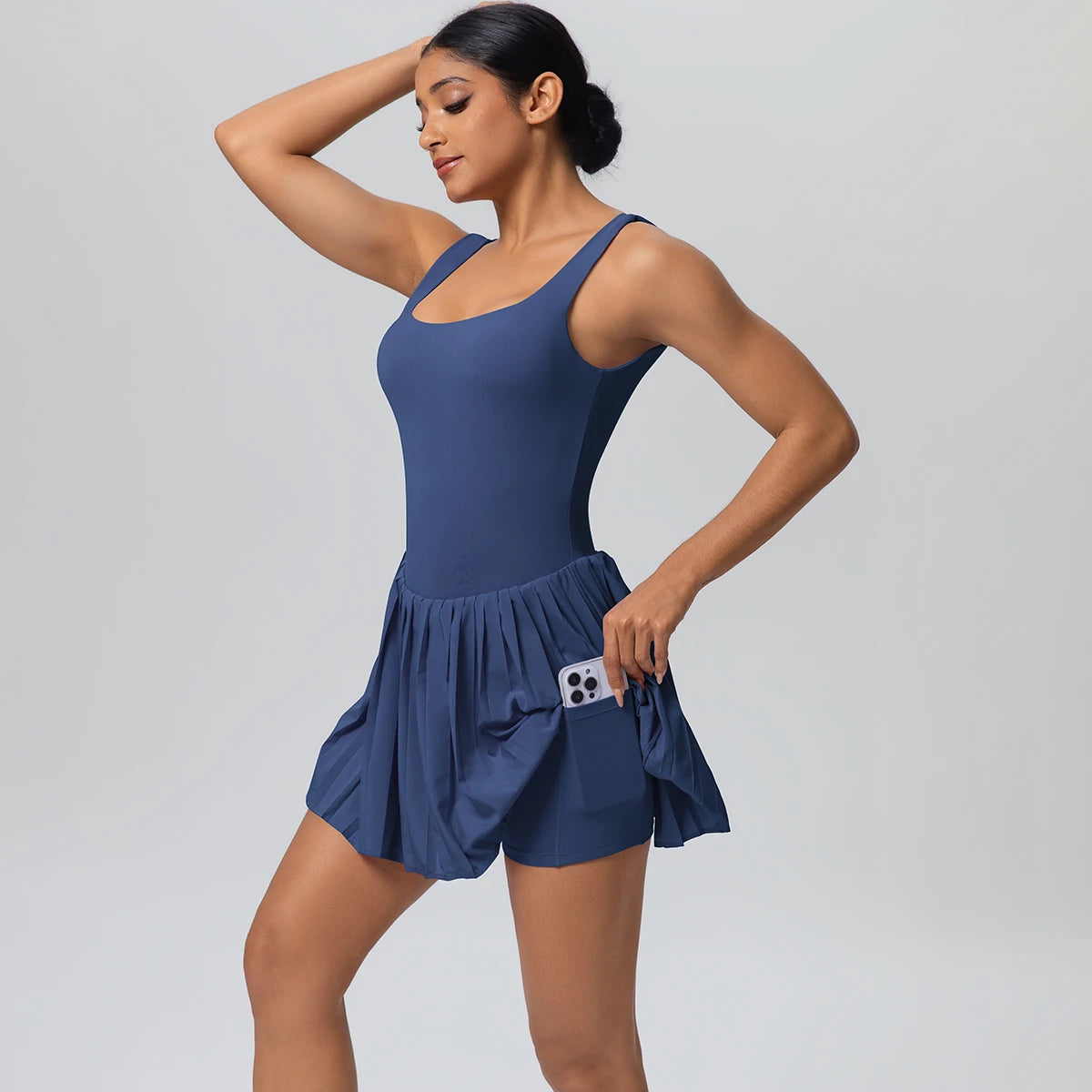 Sport-Jumpsuit Damen ärmellos dunkelblau mit ausgestelltem Rocksaum