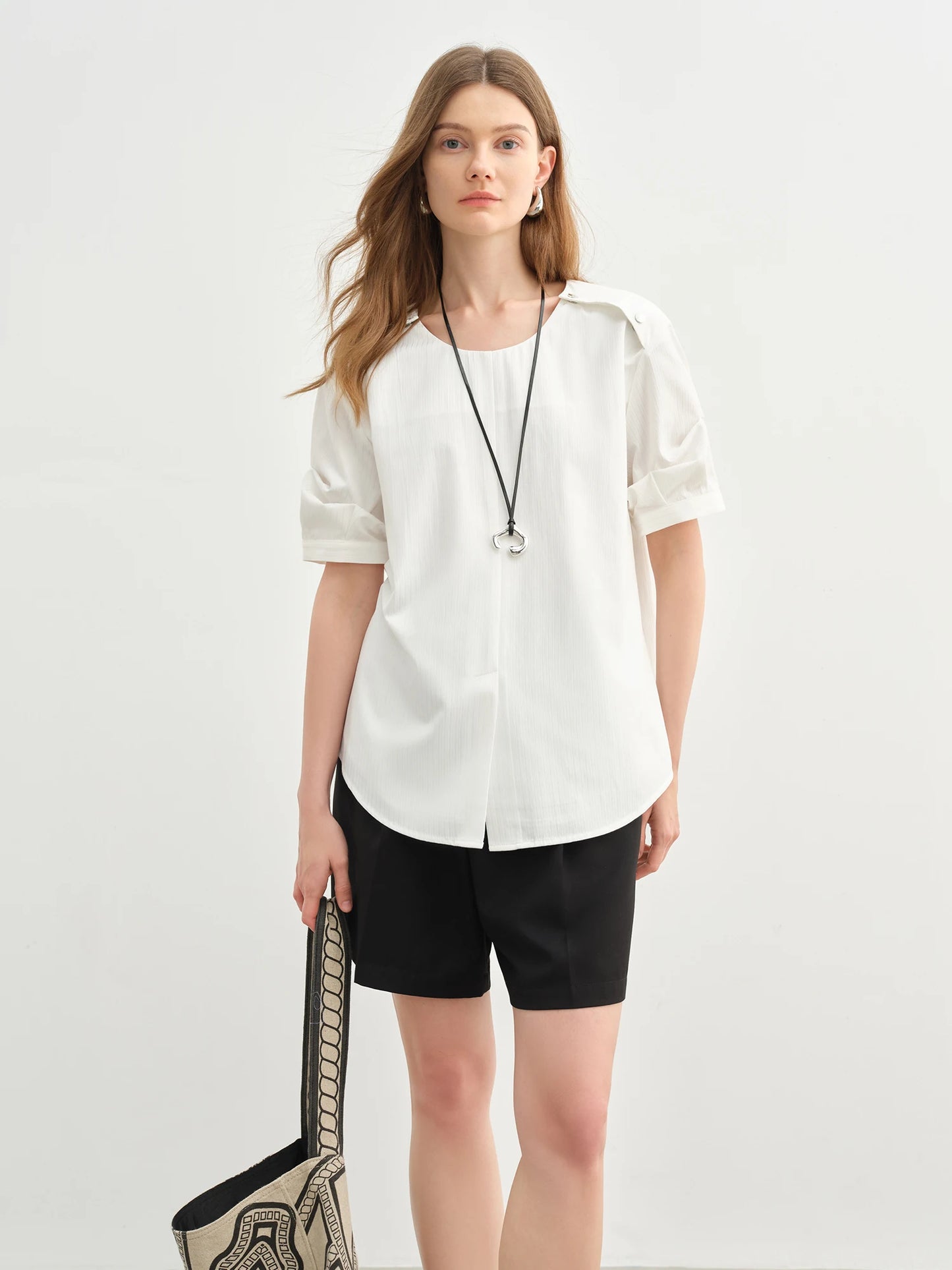 Damen-Polo-Shirt aus Baumwolle mit Polokragen, tailliertem Schnitt und abgerundetem Saum – ideal für den Sommer und den Alltag