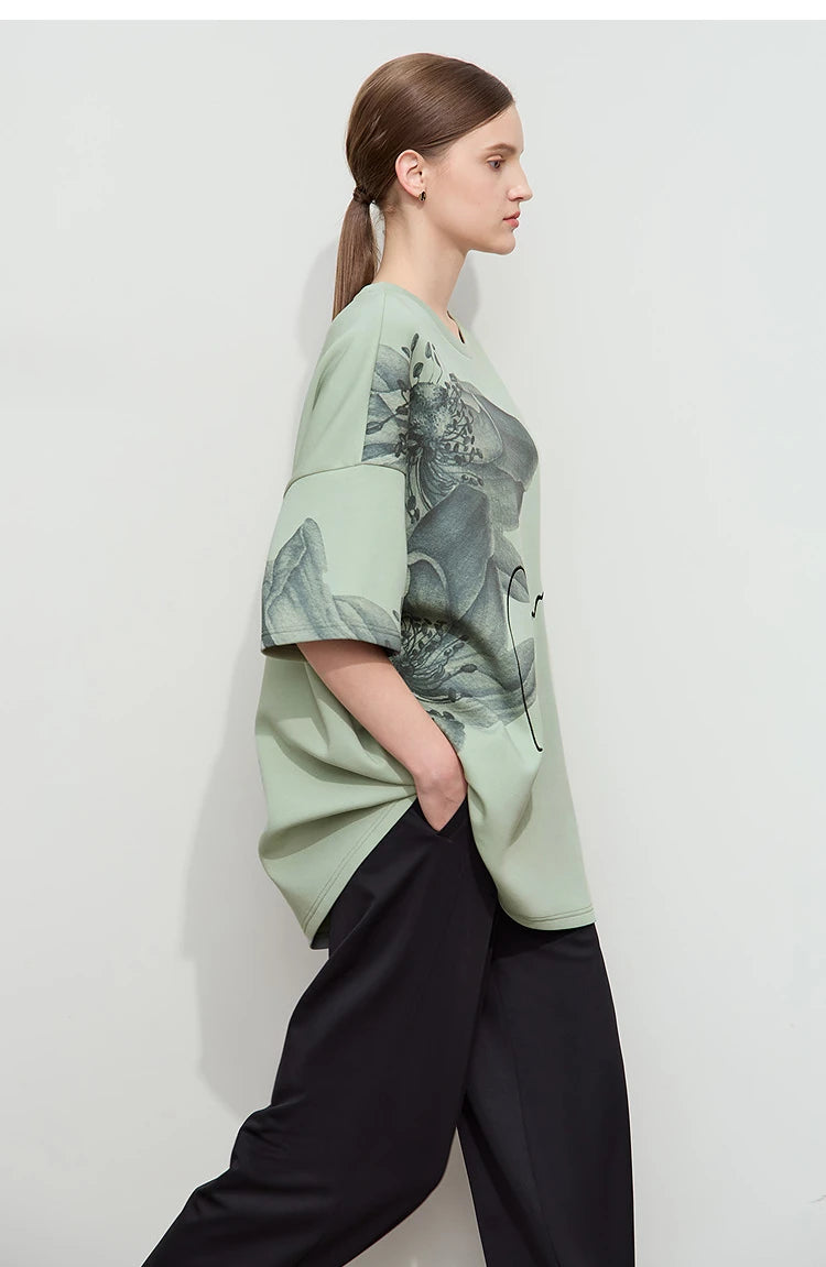 Damen T-Shirt mit lockerem O-Ausschnitt und Blumenmuster sowie Stickerei