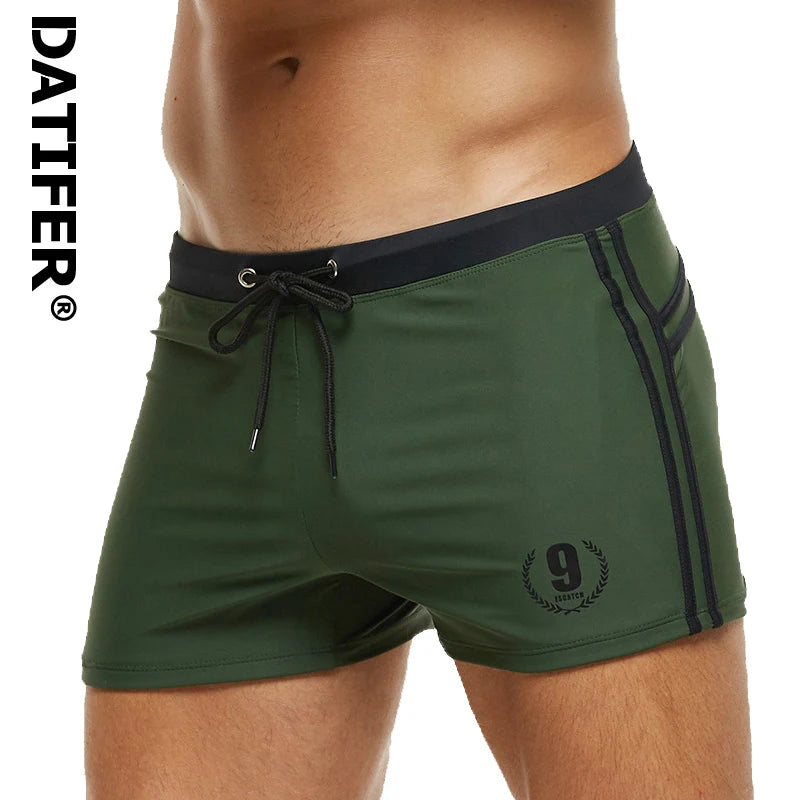 Lange Herren-Shorts mit Polyesterfutter und seitlicher Reißverschlusstasche – ideal für Fitnessstudio und Schwimmen