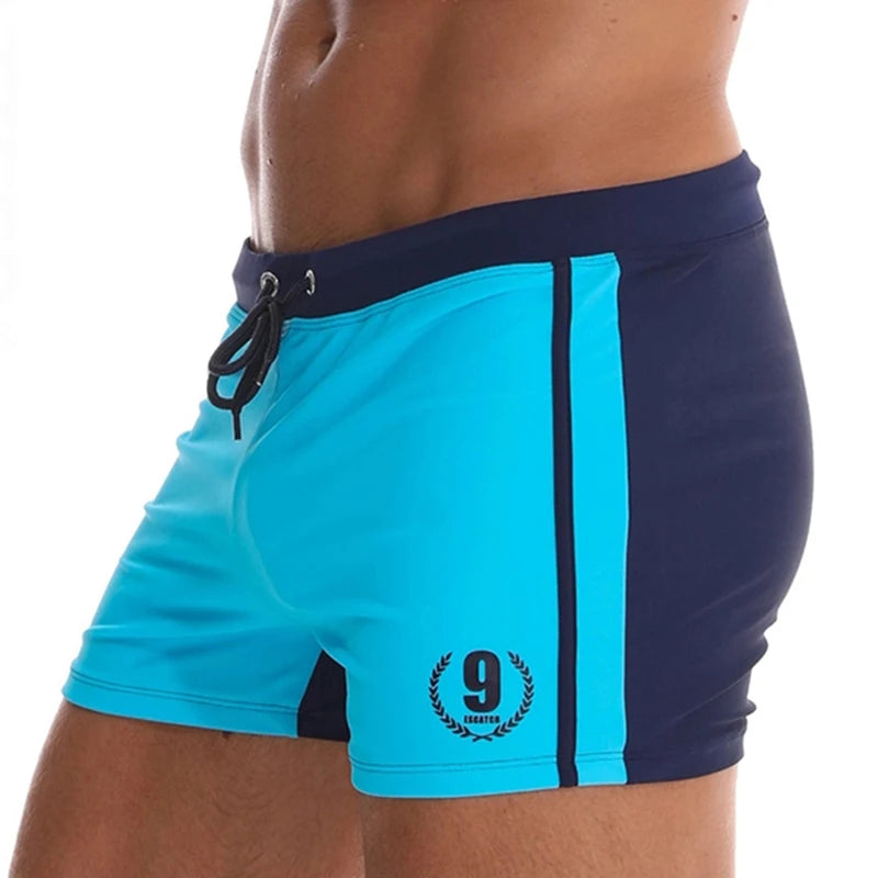 Lange Herren-Shorts mit Polyesterfutter und seitlicher Reißverschlusstasche – ideal für Fitnessstudio und Schwimmen