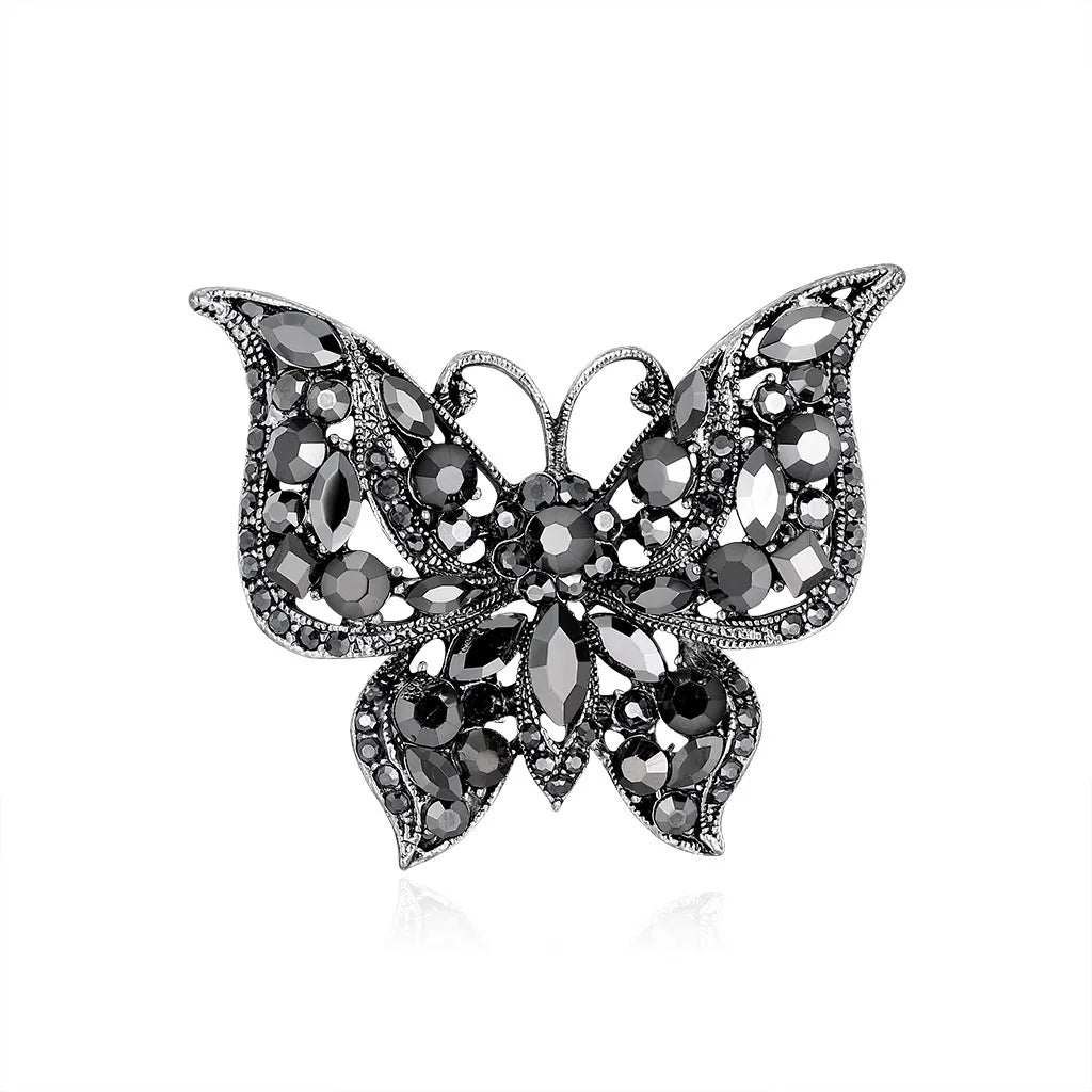 Schmetterlingsbrosche mit schwarz-silbernen Strasssteinen und glitzernder Steinfassung
