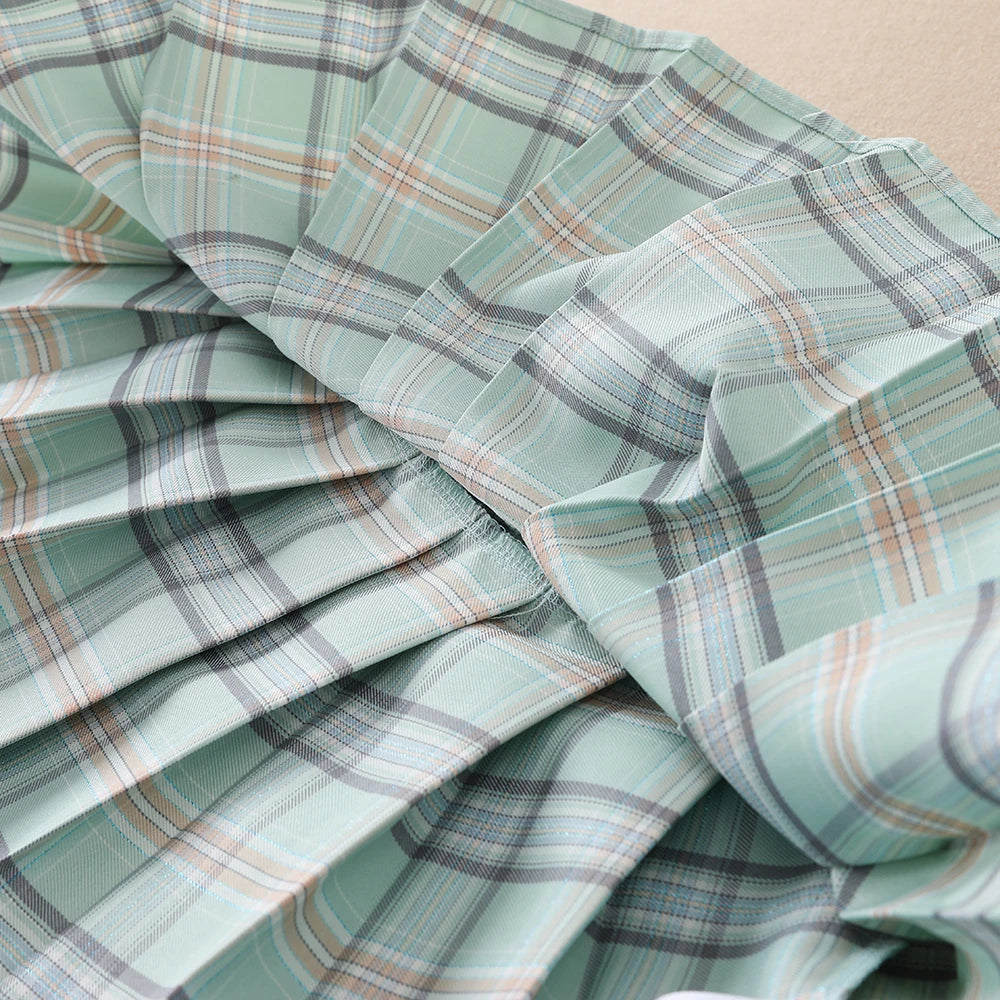 Sommer-Set für Mädchen im Alter von 2–6 Jahren mit weißem Oberteil und grünem kariertem Rock-Kombination für Kinder im Preppy-Stil mit kurzen Ärmeln