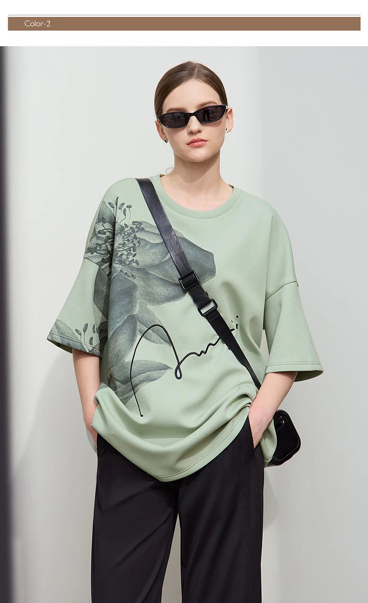 Damen T-Shirt mit lockerem O-Ausschnitt und Blumenmuster sowie Stickerei