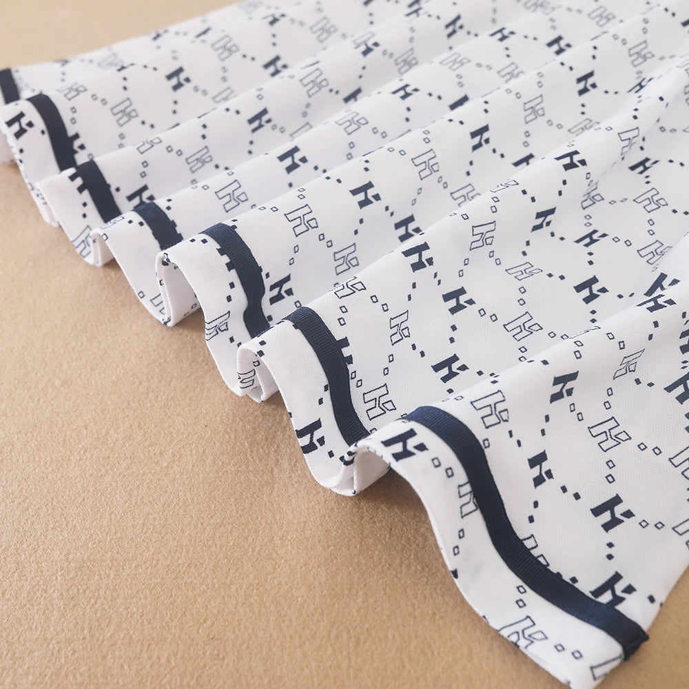 Bedrucktes Polokleid für Mädchen mit marineblauem Kragen, kurzärmliges A-Linien-Kleid mit Monogramm-Muster, weiße Sommerkleider für Kinder