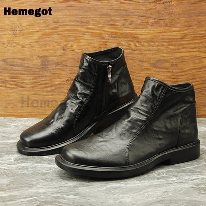 Paar dunkle Herren-Boots aus Leder mit seitlichem Reißverschluss, dicke Laufsohle, High-Top