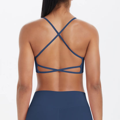 Damen-Yoga-BH Rückansicht mit gekreuztem Trägerkreuz und breitem Unterband, blau