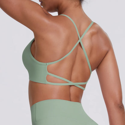 Hellgrüner Sport-BH Crop Top mit gekreuzten Rückenträgern und Aussparungen