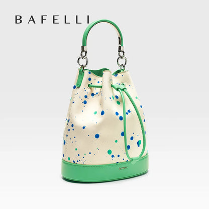 Damen-Handtasche aus Leder mit kurzem Griff, cremefarben, grüne Kanten, Punktmuster