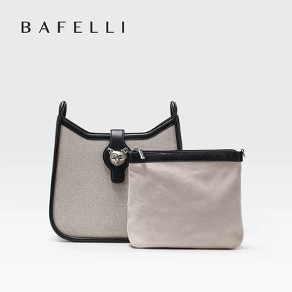 Beige Hobo-Umhängetasche mit schwarzem Besatz und Reißverschluss-Pouch vorne.