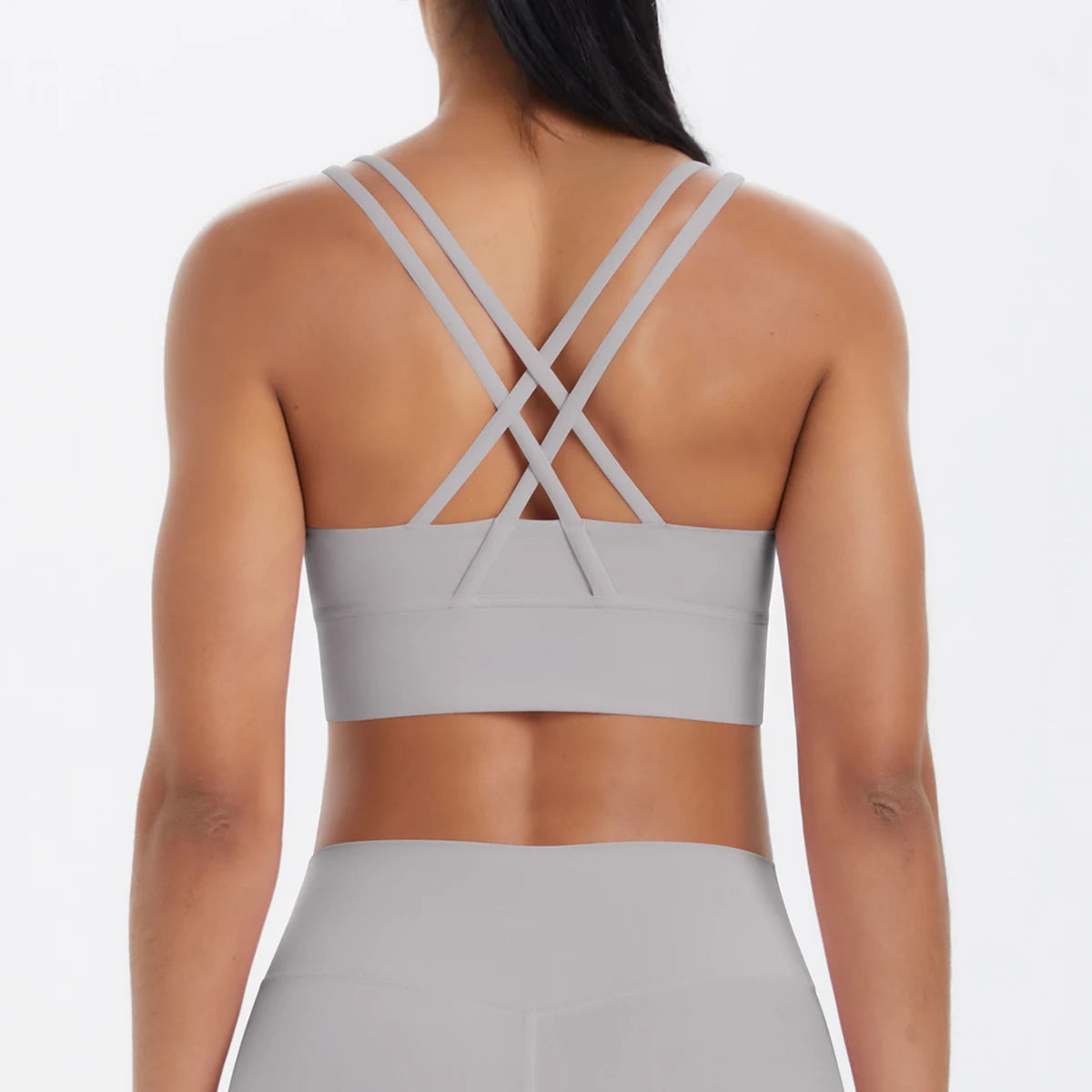 Sporttop in Hellbeige/Creme mit Kreuzträgern am Rücken und breitem Unterbrustbund