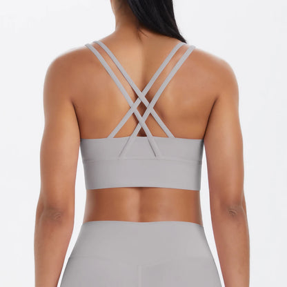 Sporttop in Hellbeige/Creme mit Kreuzträgern am Rücken und breitem Unterbrustbund