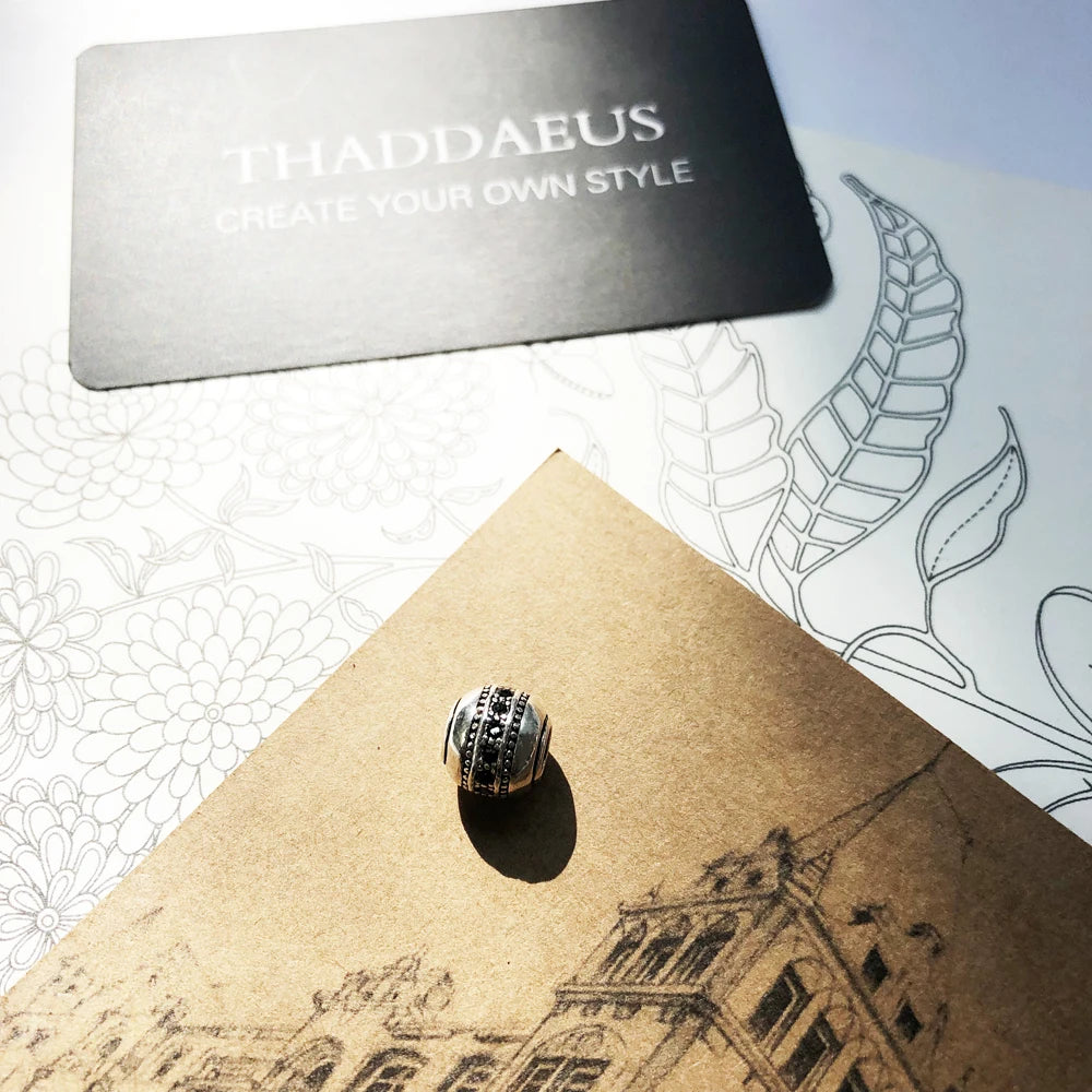 Charmperle aus 925er Silber mit schwarzem Muster und Steindekor
