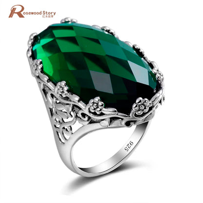 Damen-Ring aus 925er Sterlingsilber mit smaragdgrünem Stein und aufwändigem Blütenmuster