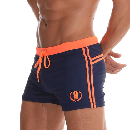 Lange Herren-Shorts mit Polyesterfutter und seitlicher Reißverschlusstasche – ideal für Fitnessstudio und Schwimmen