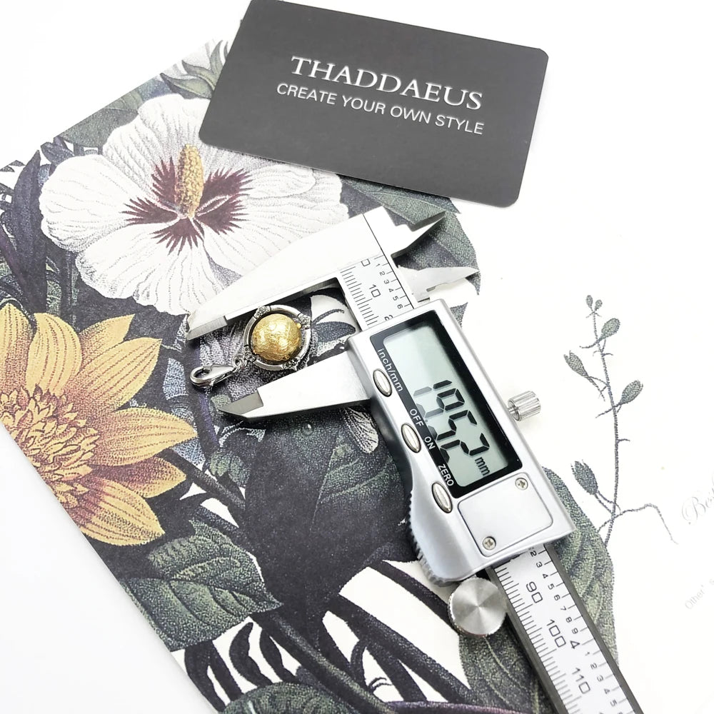 Damen-Charm-Anhänger Globus drehbar World of Rebels aus Sterlingsilber