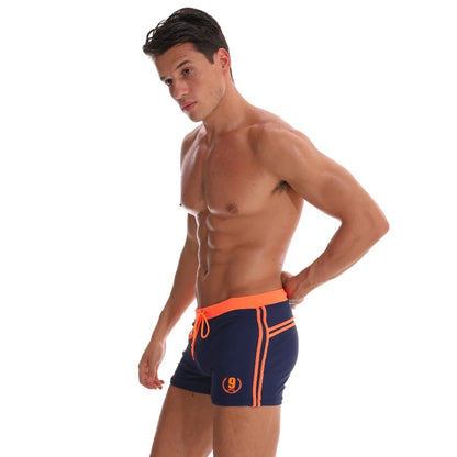 Lange Herren-Shorts mit Polyesterfutter und seitlicher Reißverschlusstasche – ideal für Fitnessstudio und Schwimmen