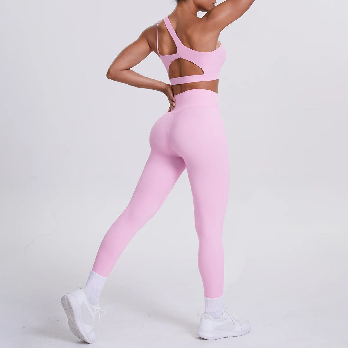 Yoga-Set aus Sport-BH und 3/4-Leggings, rosa, mit Trägern und Aussparungen