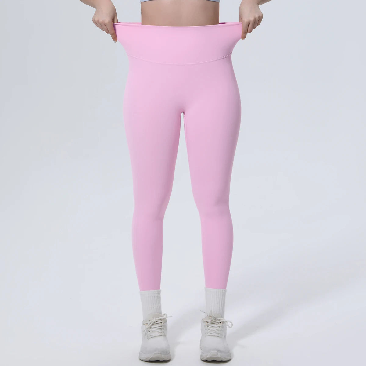 Rosa Yoga-Leggings, Blick auf den Bund und das Gesäß, eng