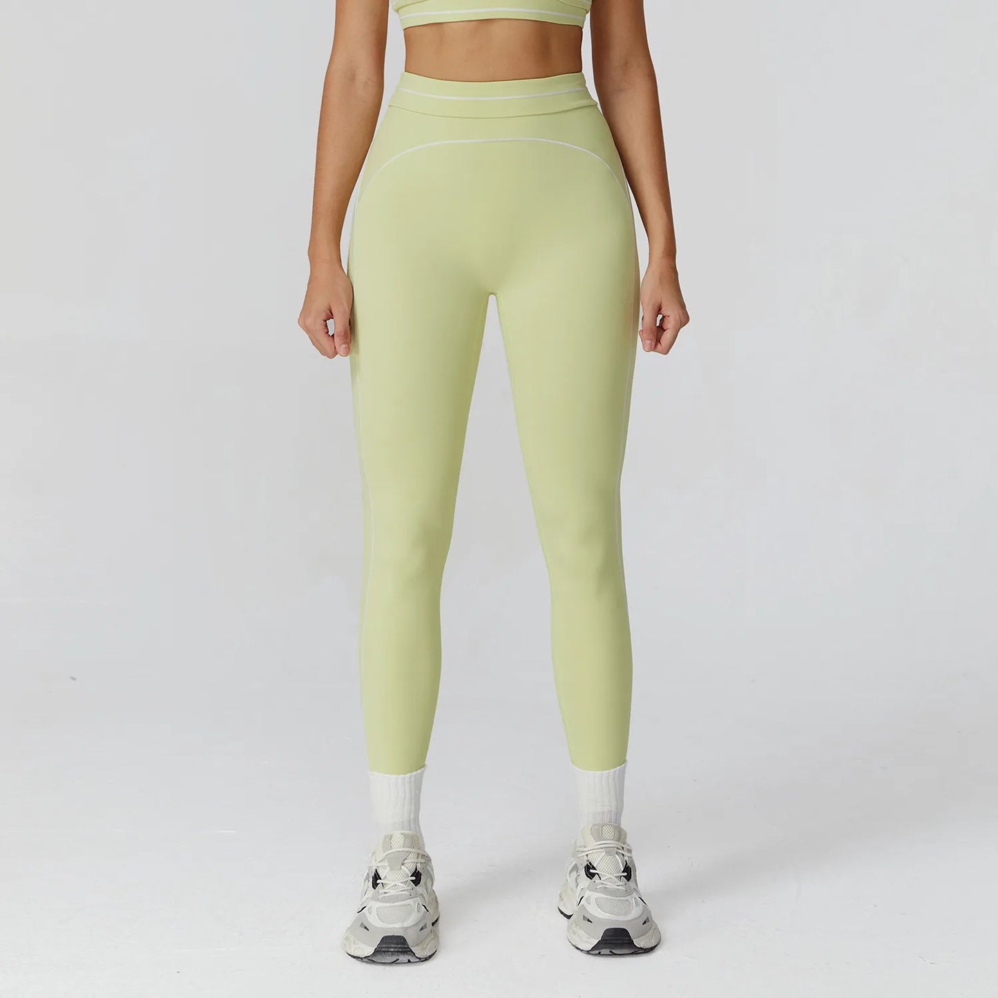 Damen Yoga-Leggings in Hellgrün/Limette mit Kontrastnähten und elastischem Bund