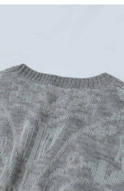 Damenpullover Rückansicht, grauer Strick mit Rundhalsausschnitt und Jacquard-Optik