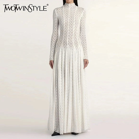 Elegante Damenbluse mit Rundhalsausschnitt und langen Ärmeln – lockerer Schnitt mit Patchwork-Design und Faltendetails.