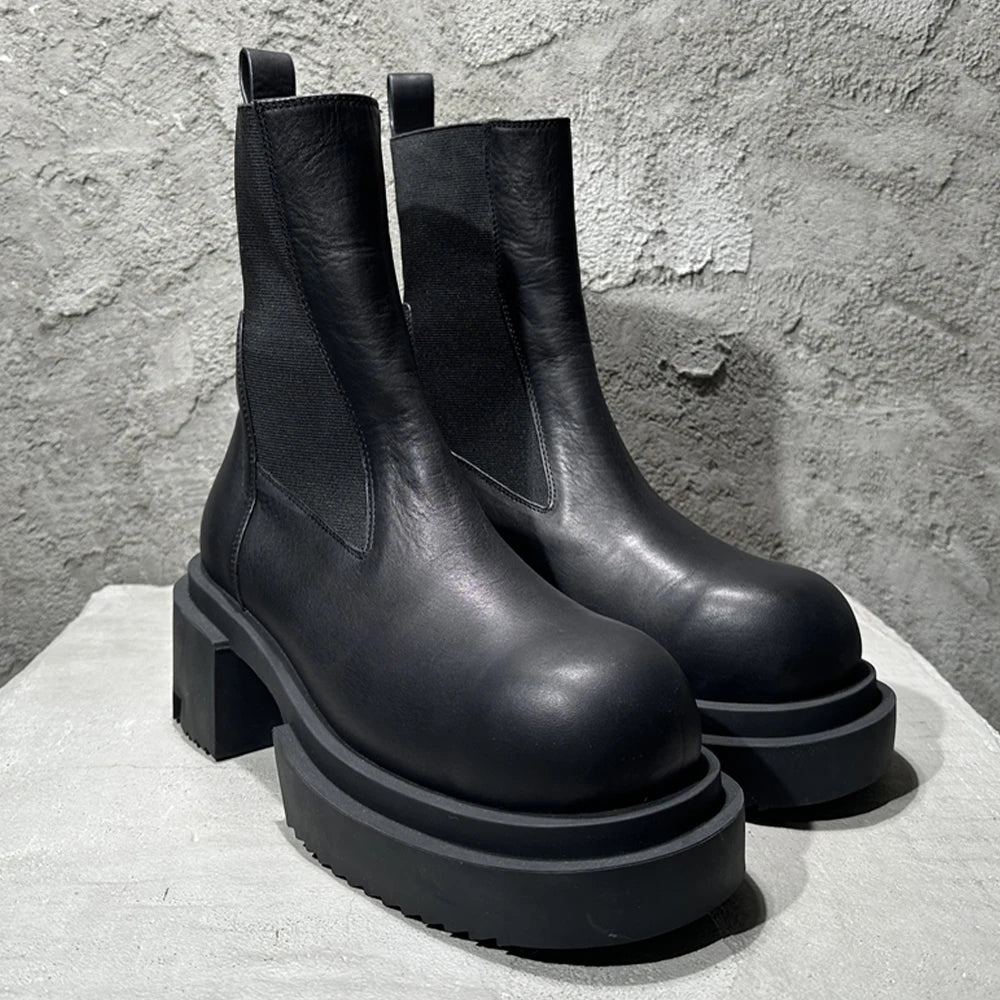 Schwarze Chelsea-Boots aus Leder mit dicker Sohle und Blockabsatz