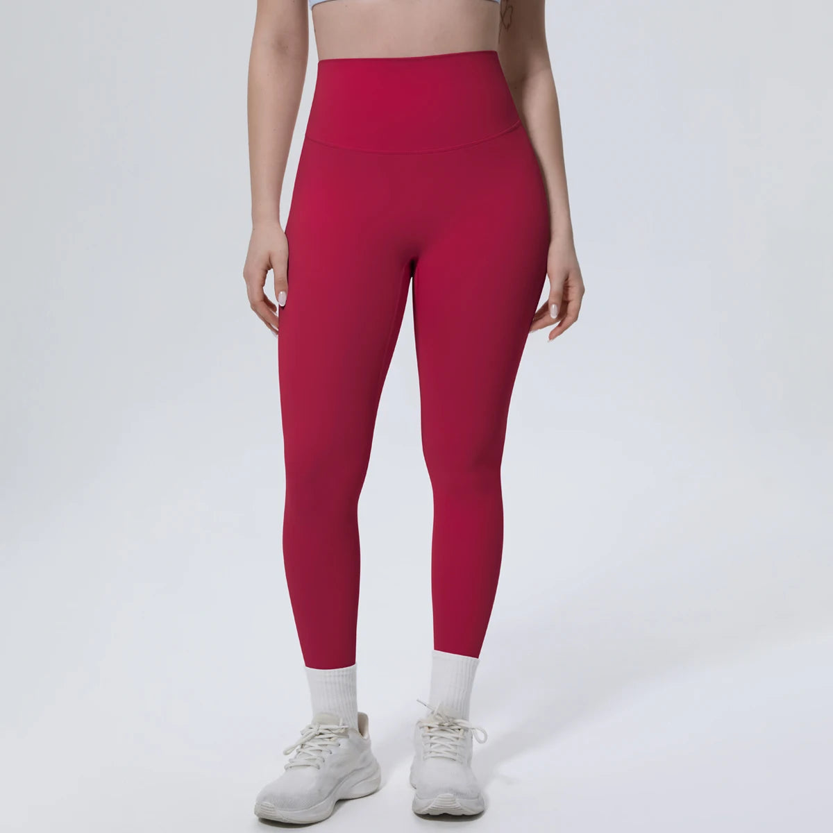 High-Waist-Yogaleggings weinrot, Vorderansicht, körperbetontes Bein mit Bund