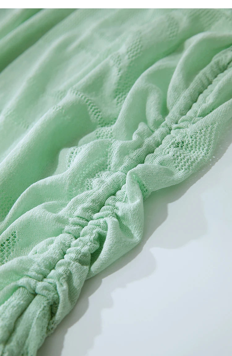 Stricktop-Saumdetail, mintgrün, geraffte Kordeloptik am unteren Rand