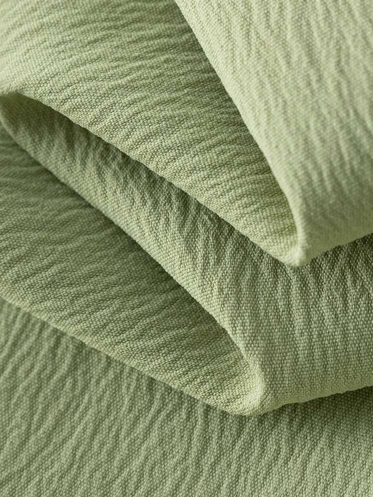 Langarm-Bluse mit V-Ausschnitt und Jacquard-Stoff im chinesischen Stil – einreihig geknöpft in zwei Farben.