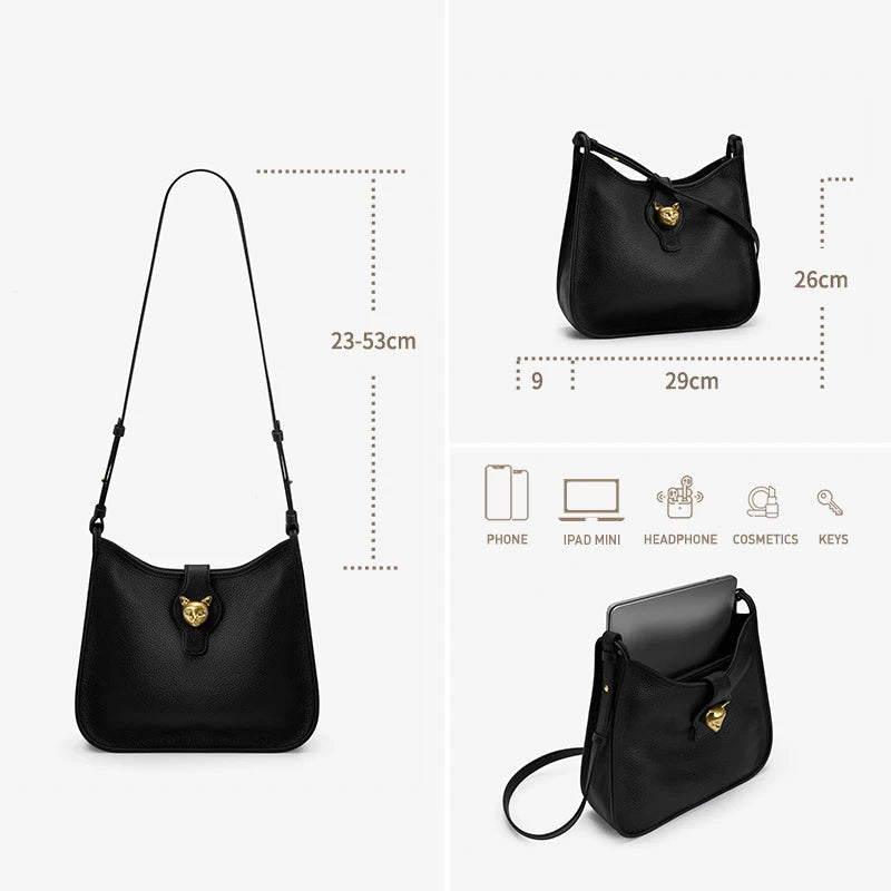 Schwarze leichte Leder-Eimer-Tasche mit goldfarbenem Katzenanhänger an der Vorderseite