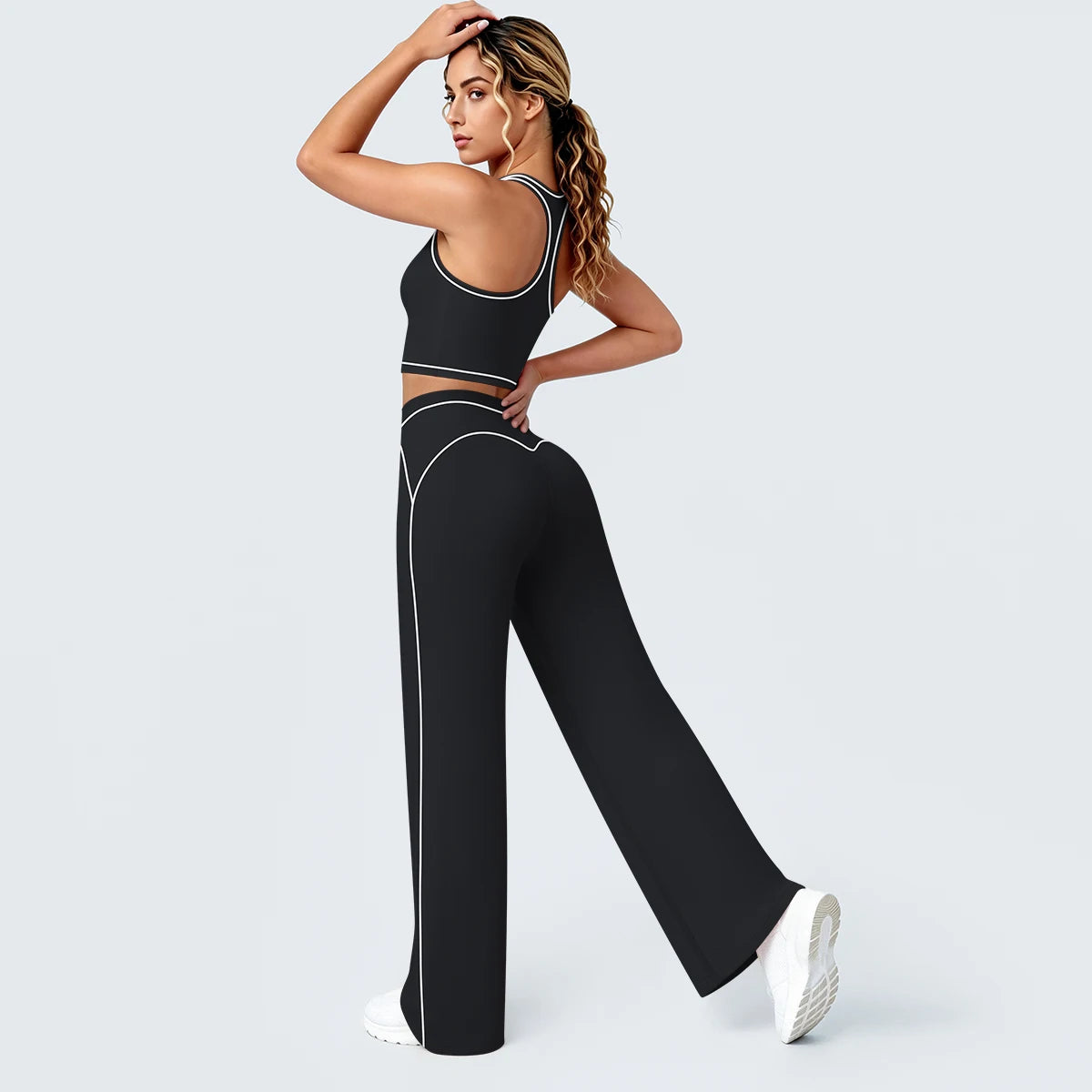 Yoga-Set Damen: I-Rücken-Top und weite Hose, schwarz mit hellen Zierlinien
