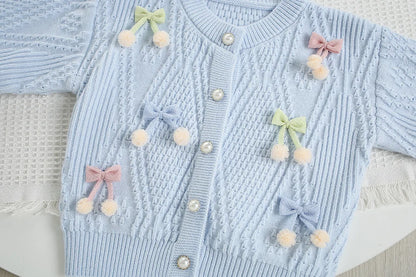Mädchen Strickjacke in Candy-Farbe mit Bogen für den Herbst