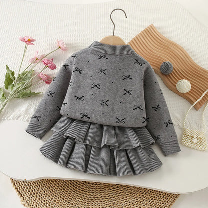 Mädchen Kleidungsset mit Bogen Druck Pullover und Faltenrock im 2-Teile Design