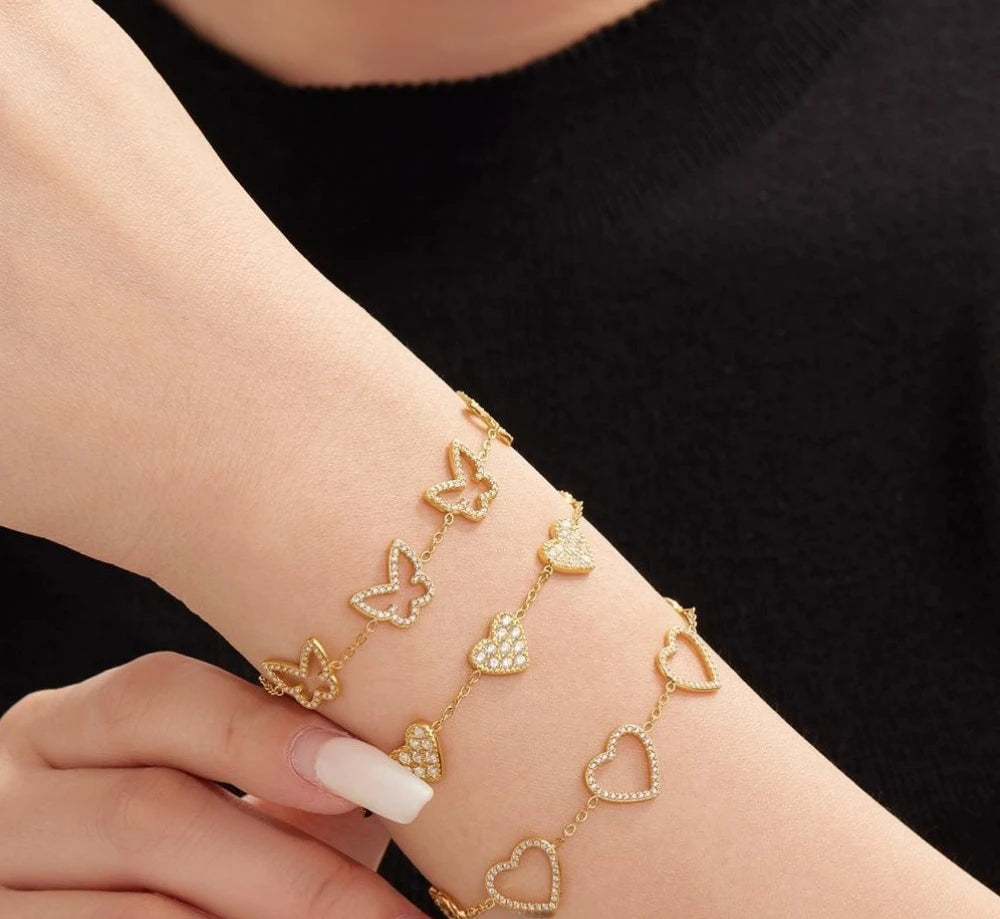 Damen-Charm-Armband mit Herzschleife und Zirkonia