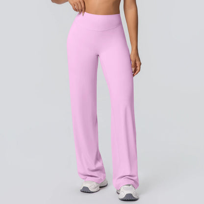 Weite Yoga-Hose in hellem Rosa, hohe Taille und gerader, weit auslaufender Schnitt.