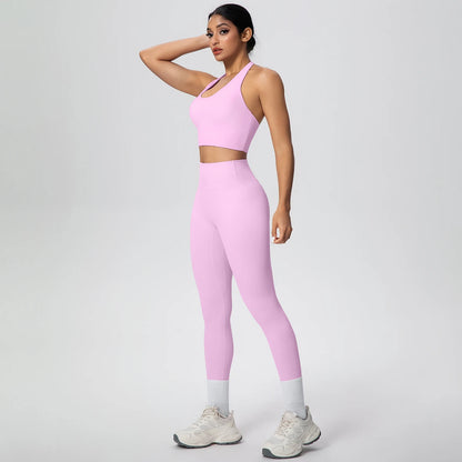 Rosa Yoga-Set: Trägertop mit kurzem Schnitt und hochbundige Leggings mit Saumeinsatz