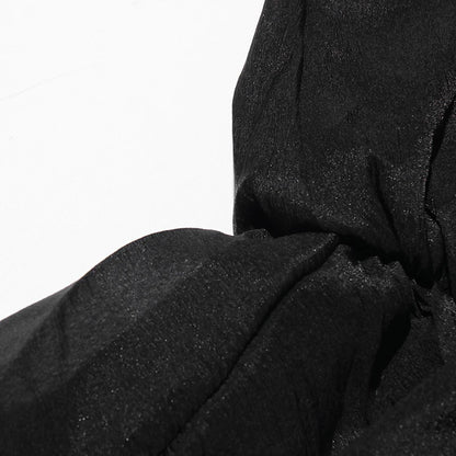Zweiteiliges Damen-Set mit schulterfreiem Oberteil, langen Ärmeln und Schleifendetail sowie Patchwork-Rock mit Rüschen – elegant und modern.