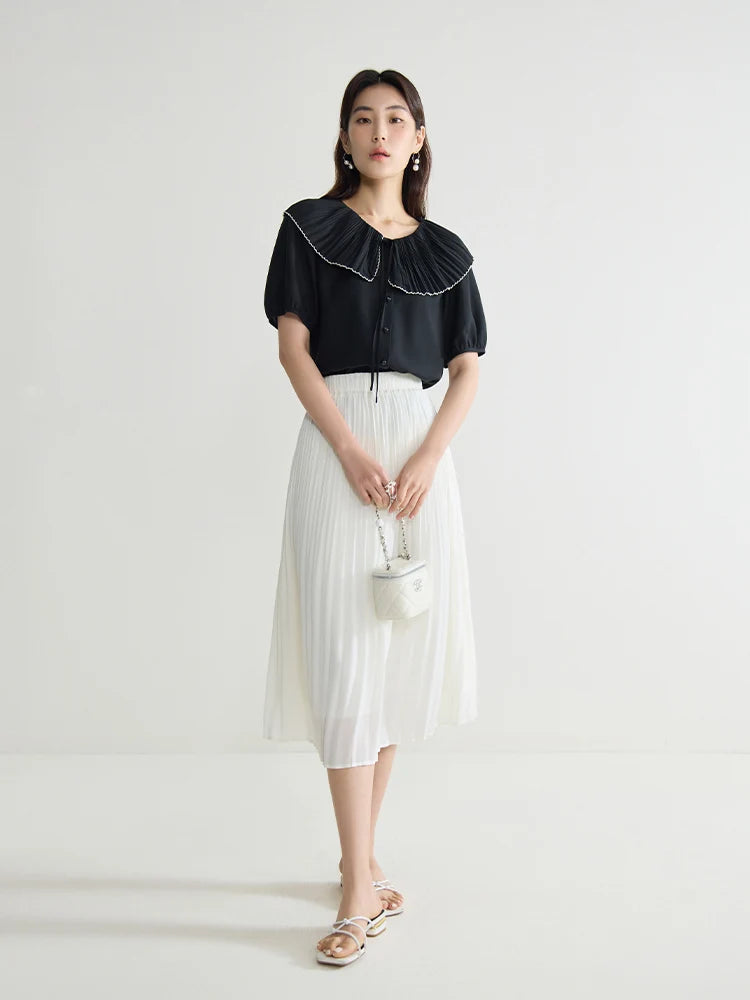 Elegante schwarze Bluse mit französischem Flair und figurformender Silhouette – Sommer-Textur für große Größen