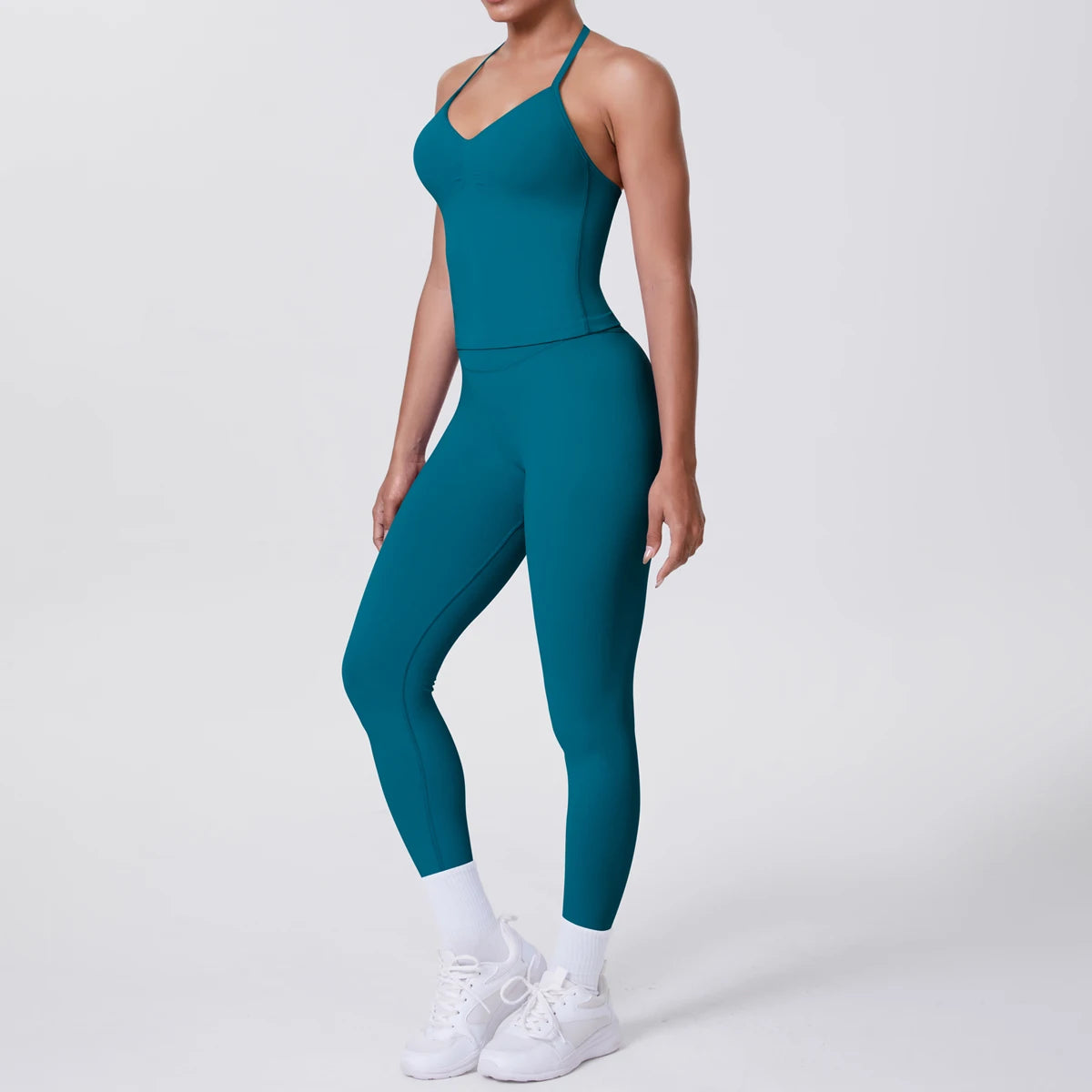 Damen Yoga-Set mit ärmelloser Weste und Leggings, petrolblau