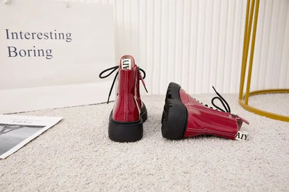 Damen-Ankle-Boots aus Leder, rot, Schnürung, hochgezogene Schaftkante, Profilsohle
