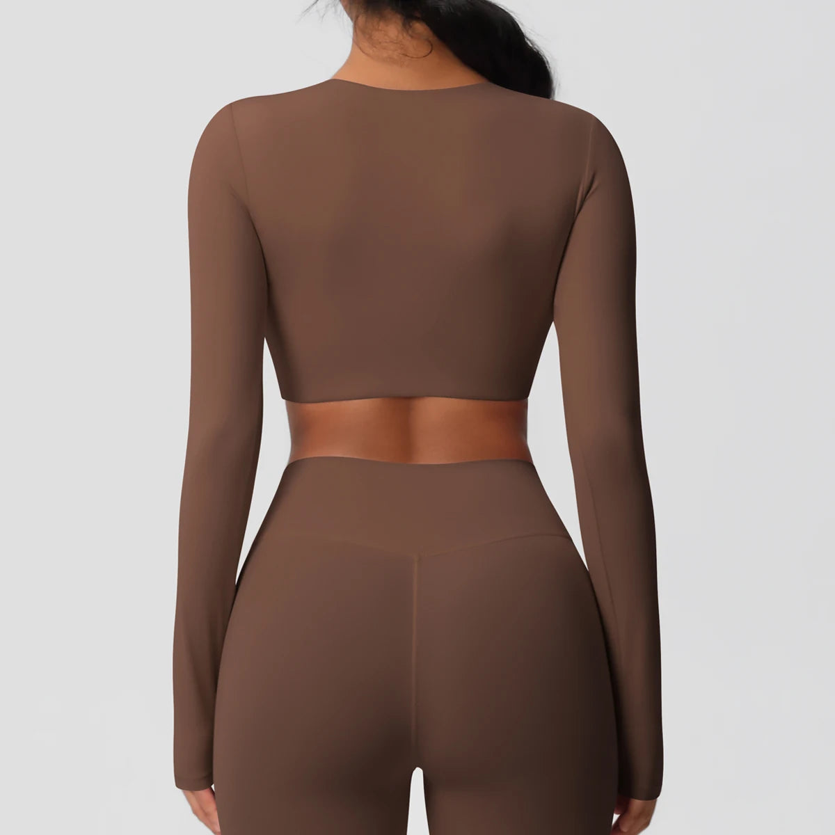 Damen Sportshirt Rückenansicht, langarm, kurz geschnitten, schokoladenbraun