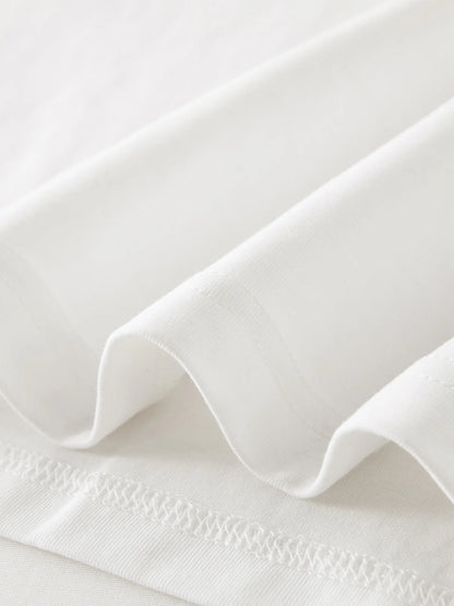 Damen T-Shirt mit V-Ausschnitt und strukturierten Schultern im Retro-Twist-Knotendesign für eine schlanke Silhouette