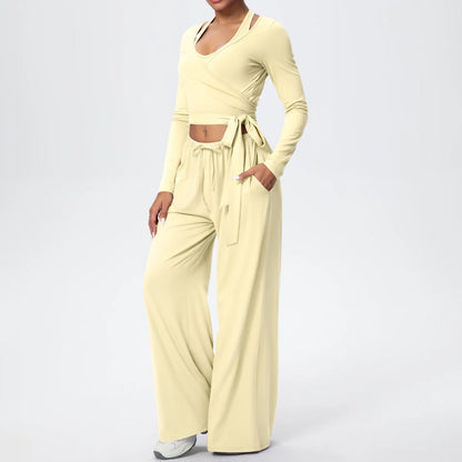 Damen-Sportset mit Wickeloberteil und weiter Langarmhose, hellgelb, mit Bindegürtel