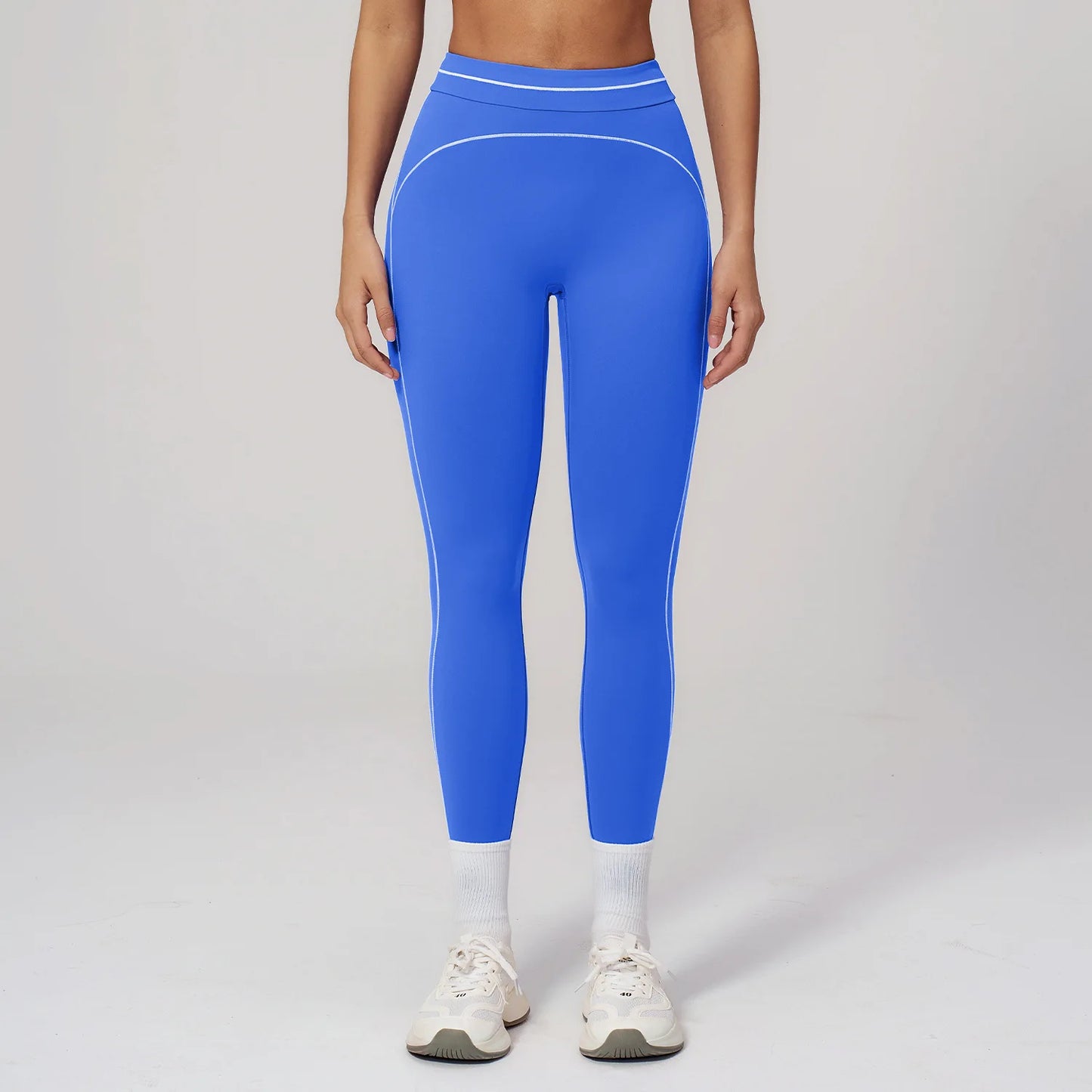 Damen Fitness-Leggings in Blau mit Kontrastlinien am Bein und hellem Bund